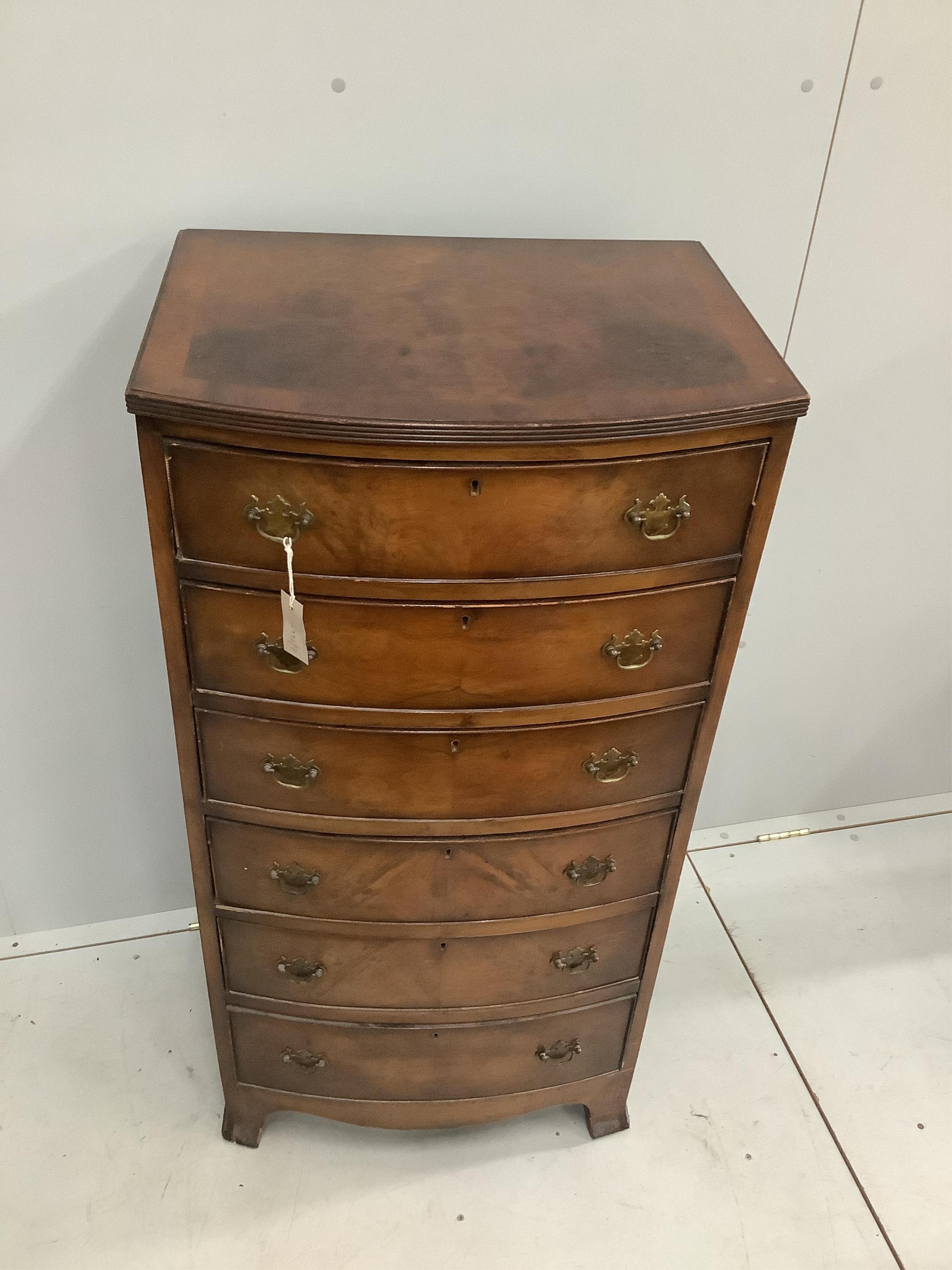 A reproduction Queen Anne style walnut six drawer narrow bow front chest, width 60cm, depth 47cm, height 120cm. Condition - poor to fair